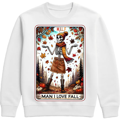 A cozy graphic white sweatshirt featuring a cute skeleton with fall accessories and the phrase “M.I.L.F. – Man I Love Fall,” surrounded by pumpkins and autumn elements.