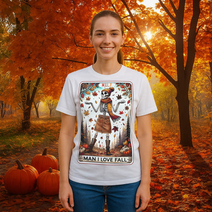 A graphic t-shirt featuring a stylish skeleton in fall attire with the phrase “M.I.L.F. – Man I Love Fall,” surrounded by autumn leaves and pumpkins.