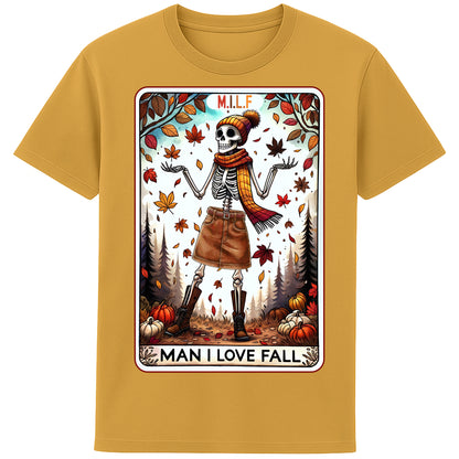 A ochre colour graphic t-shirt featuring a stylish skeleton in fall attire with the phrase “M.I.L.F. – Man I Love Fall,” surrounded by autumn leaves and pumpkins.