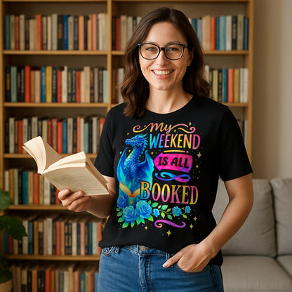 A woman wearing a black “My Weekend Is All Booked” t-shirt with blue dragon and book design