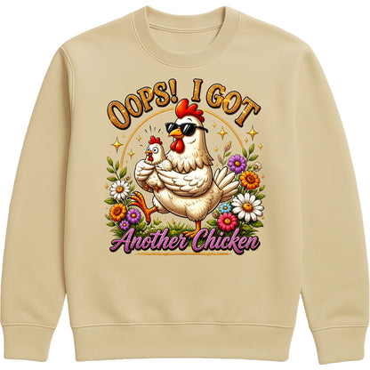 Desert sand colour Oops! I Got Another Chicken Sweatshirt featuring a funny hen wearing sunglasses with a chick, colourful wildflowers and playful farmhouse artwork for chicken lovers.