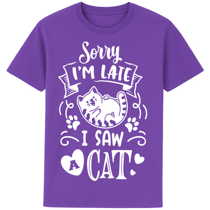 Funny cat lover T-shirt in purple colour featuring a cartoon cat, paw prints, hearts, and the phrase "Sorry I'm Late, I Saw A Cat".