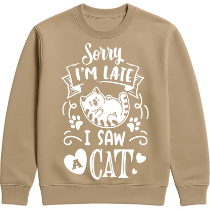 A mocha brown colour sweatshirt featuring a lounging white cat, paw prints, and the slogan "Sorry I'm Late, I Saw a Cat", perfect for cat lovers, cat owners, and anyone who always stops to say hello to a cat.