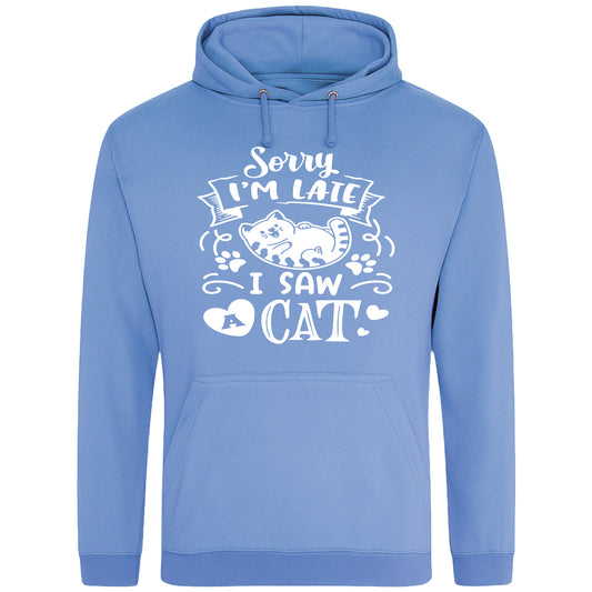 A playful blue hoodie with white text and a charming design on the front. It reads: "Sorry I'm late I saw a cat" accompanied by a cartoon cat illustration, paw prints, and whimsical accents. Perfect for cat lovers and those who embrace their feline-induced tardiness with humor.