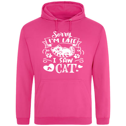 A playful hot pink hoodie with white text and a charming design on the front. It reads: "Sorry I'm late I saw a cat" accompanied by a cartoon cat illustration, paw prints, and whimsical accents. Perfect for cat lovers and those who embrace their feline-induced tardiness with humor.