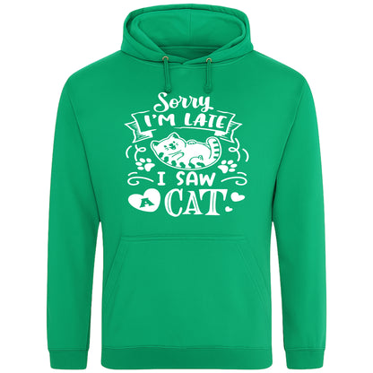A playful kelly greene hoodie with white text and a charming design on the front. It reads: "Sorry I'm late I saw a cat" accompanied by a cartoon cat illustration, paw prints, and whimsical accents. Perfect for cat lovers and those who embrace their feline-induced tardiness with humor.