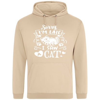 A playful nude colour hoodie with white text and a charming design on the front. It reads: "Sorry I'm late I saw a cat" accompanied by a cartoon cat illustration, paw prints, and whimsical accents. Perfect for cat lovers and those who embrace their feline-induced tardiness with humor.