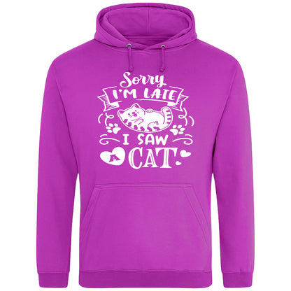 A playful pinky purple hoodie with white text and a charming design on the front. It reads: "Sorry I'm late I saw a cat" accompanied by a cartoon cat illustration, paw prints, and whimsical accents. Perfect for cat lovers and those who embrace their feline-induced tardiness with humor.