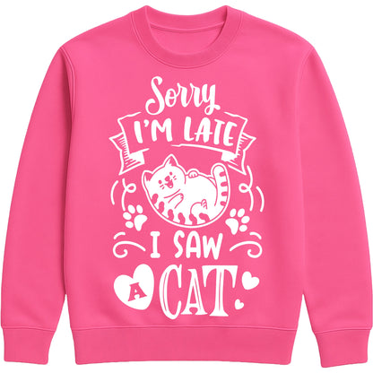 A hot pink sweatshirt with white text and a charming design on the front. It reads: "Sorry I'm late I saw a cat" accompanied by a cartoon cat illustration, paw prints, and whimsical accents. Perfect for cat lovers and those who embrace their feline-induced tardiness with humour.