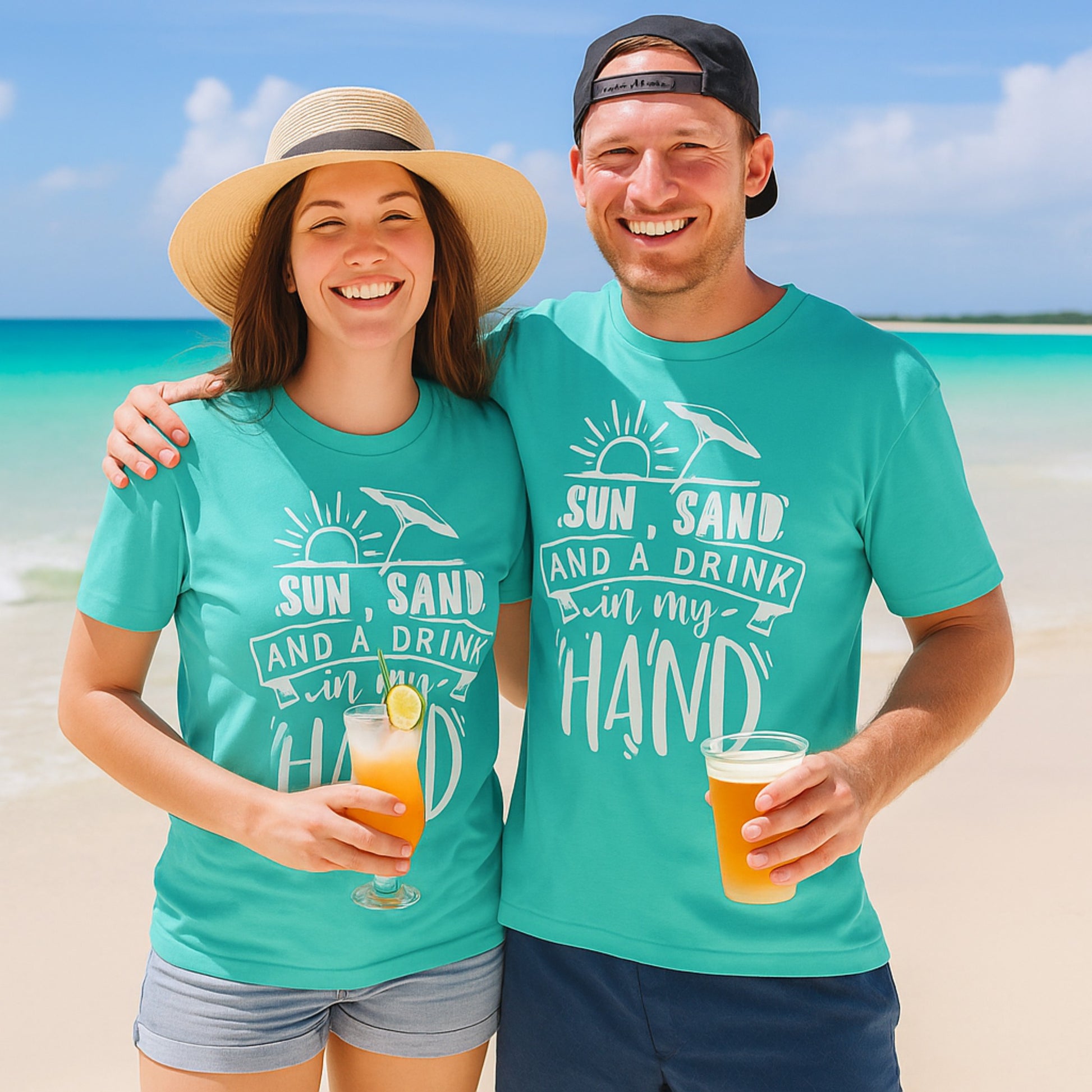 2 people wearing a t-shirt with “Sun, Sand, and a Drink in My Hand” graphic, fun summer fashion for beach lovers