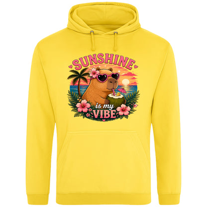 Yellow Sunshine Is My Vibe Capybara Hoodie featuring a tropical beach graphic with a relaxed capybara, palm trees, hibiscus flowers and a colourful summer sunset.
