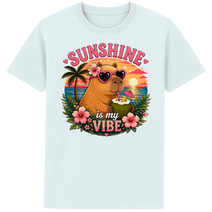 Ice Blue Colour Sunshine Is My Vibe Capybara T-Shirt featuring a cute capybara wearing heart-shaped sunglasses, holding a coconut drink with tropical flowers, palm trees and a colourful summer beach sunset graphic.