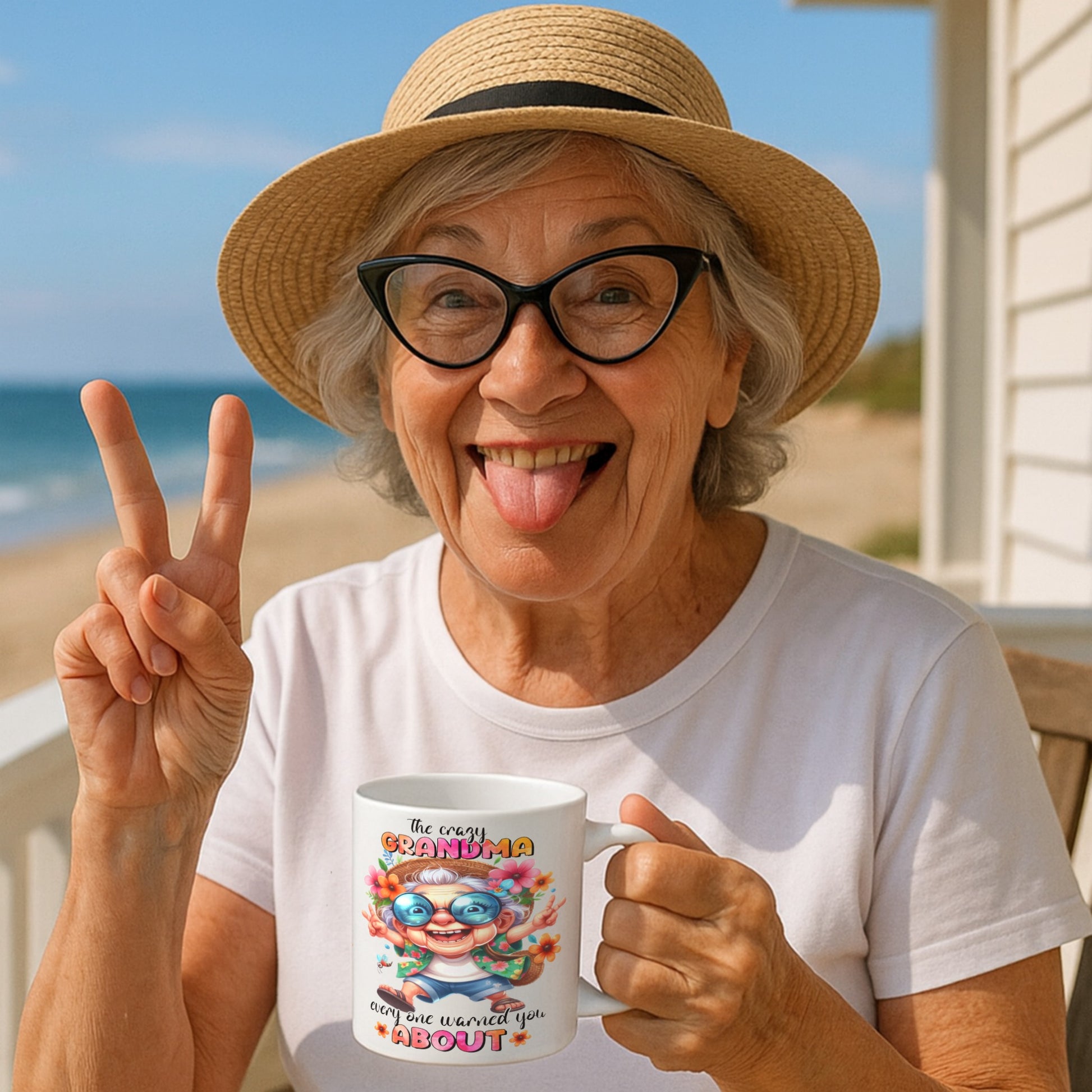 Woman on a beach holding a funny coffee mug with sassy ‘Crazy Grandma Everyone Warned You About’ design – the ultimate gift for cool, bold grandmas