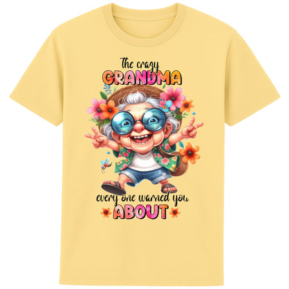 Funny grandma shirt featuring a colourful cartoon grandma wearing sunglasses and floral clothing with the quote "The Crazy Grandma Everyone Warned You About" on a yellow t-shirt.
