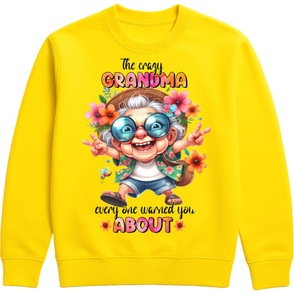 Yellow funny grandma sweatshirt featuring a colourful cartoon grandma wearing sunglasses with the phrase "The Crazy Grandma Everyone Warned You About", perfect gift for grandma, grandmother birthday gift, Grandparents Day gift, and gift from grandkids.