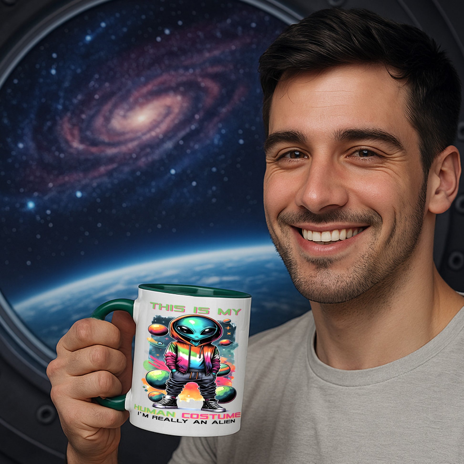 Man holding a mug with an alien design against a space-themed background mug says this is my human costume i'm really an alien