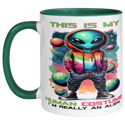 Man holding a funny UFO mug featuring a colourful alien in a rainbow hoodie surrounded by planets and cosmic artwork, with a space-themed galaxy backdrop.